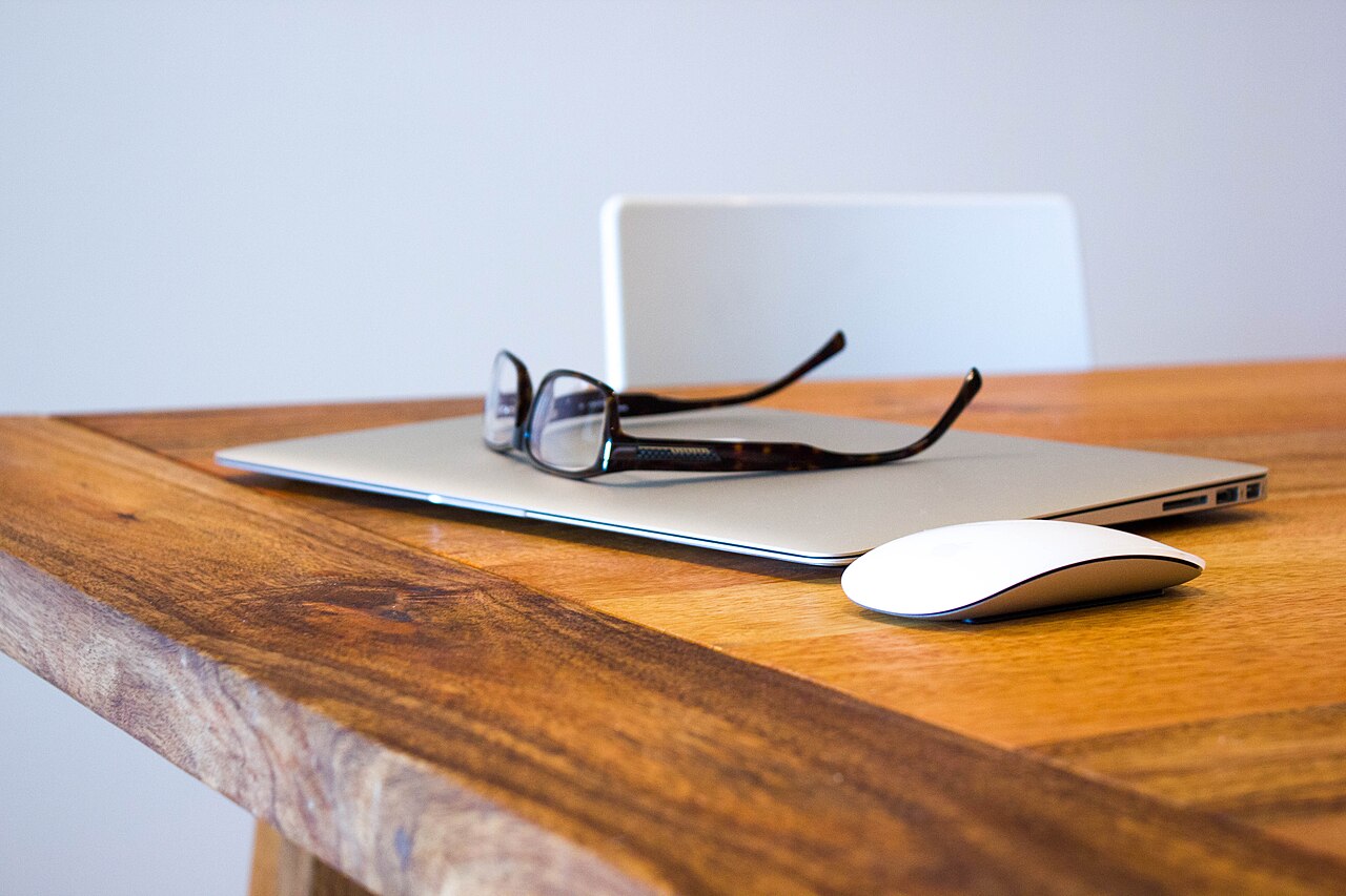 Workspace with a laptop used for independent tech research