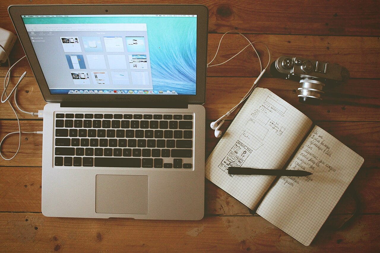 Home office desk setup with a laptop and camera